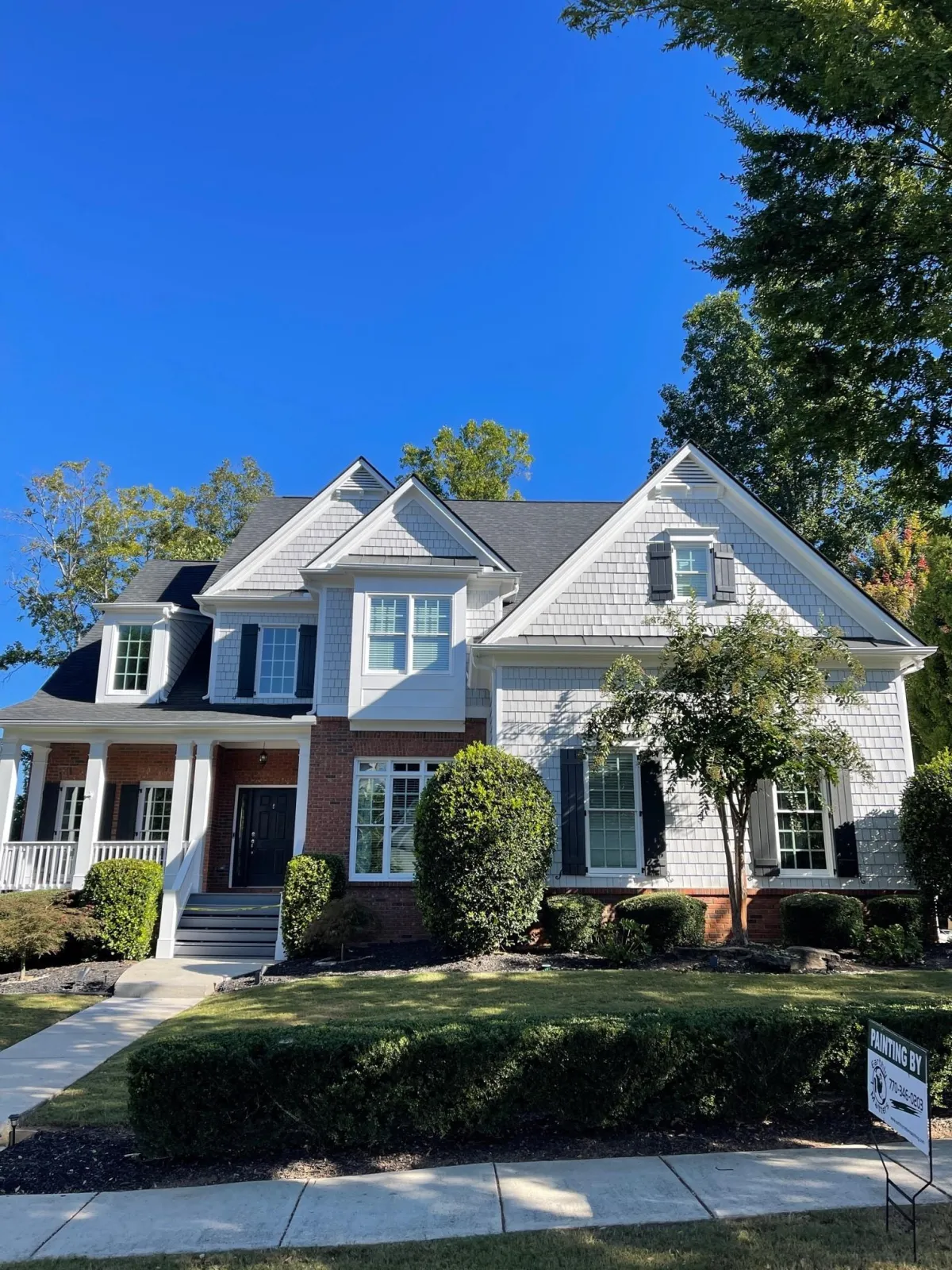 professional exterior painting on cedar shake and brick home in Sandy Springs GA