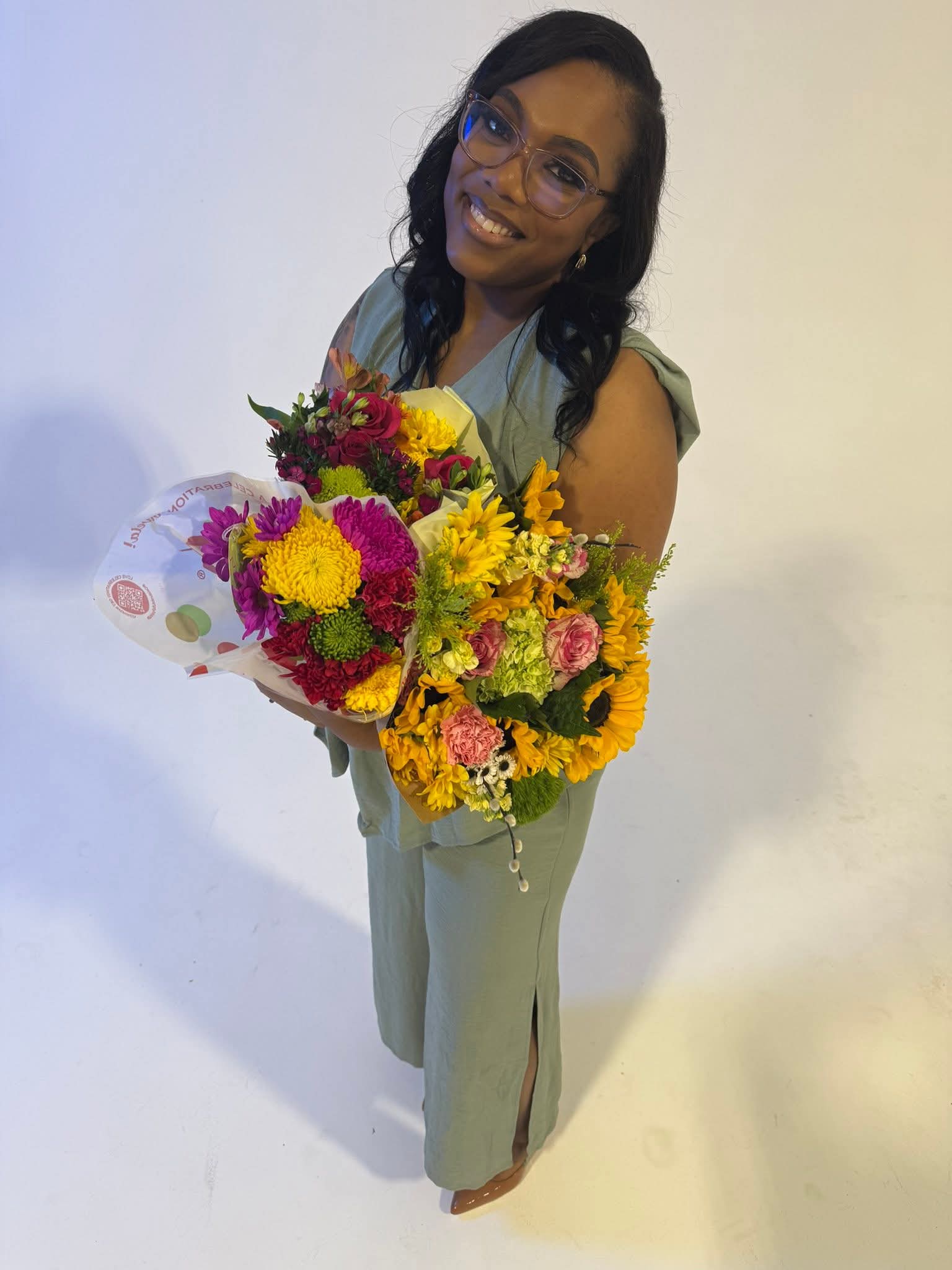 Ravonnee speaking with a guest in a podcast studio setting