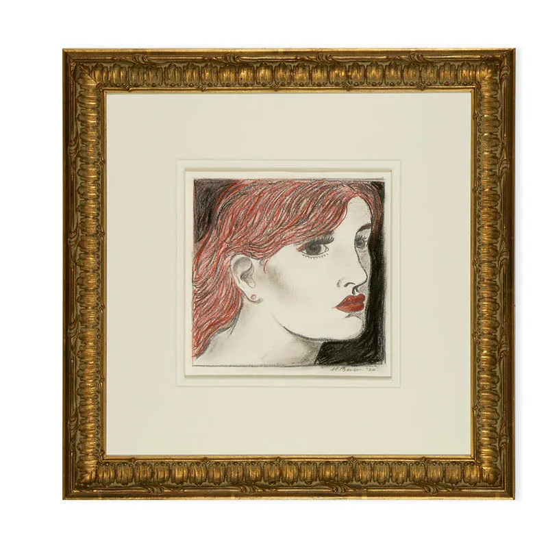 gold ornate custom frame print of a drawing of a womans head with double mat