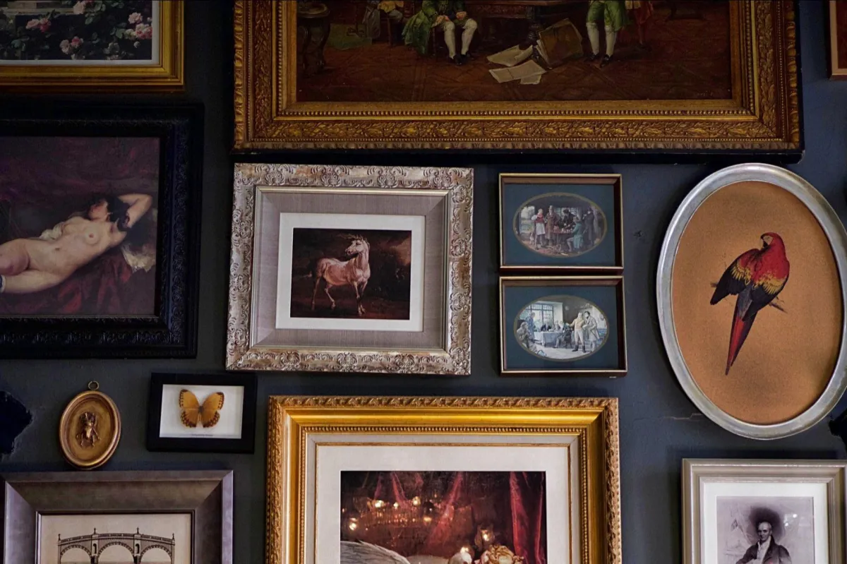 Fine art framing of various artwork on a wall