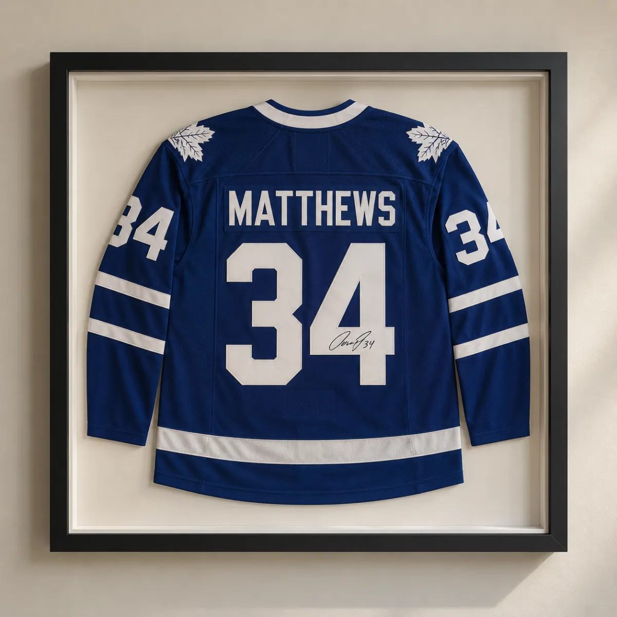 Custom framed Auston Matthews Toronto Maple Leafs jersey with autograph displayed in a shadow box
