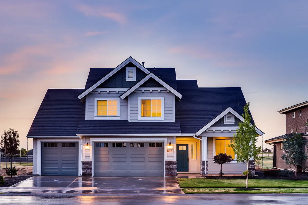 White bullet train at a station platform.