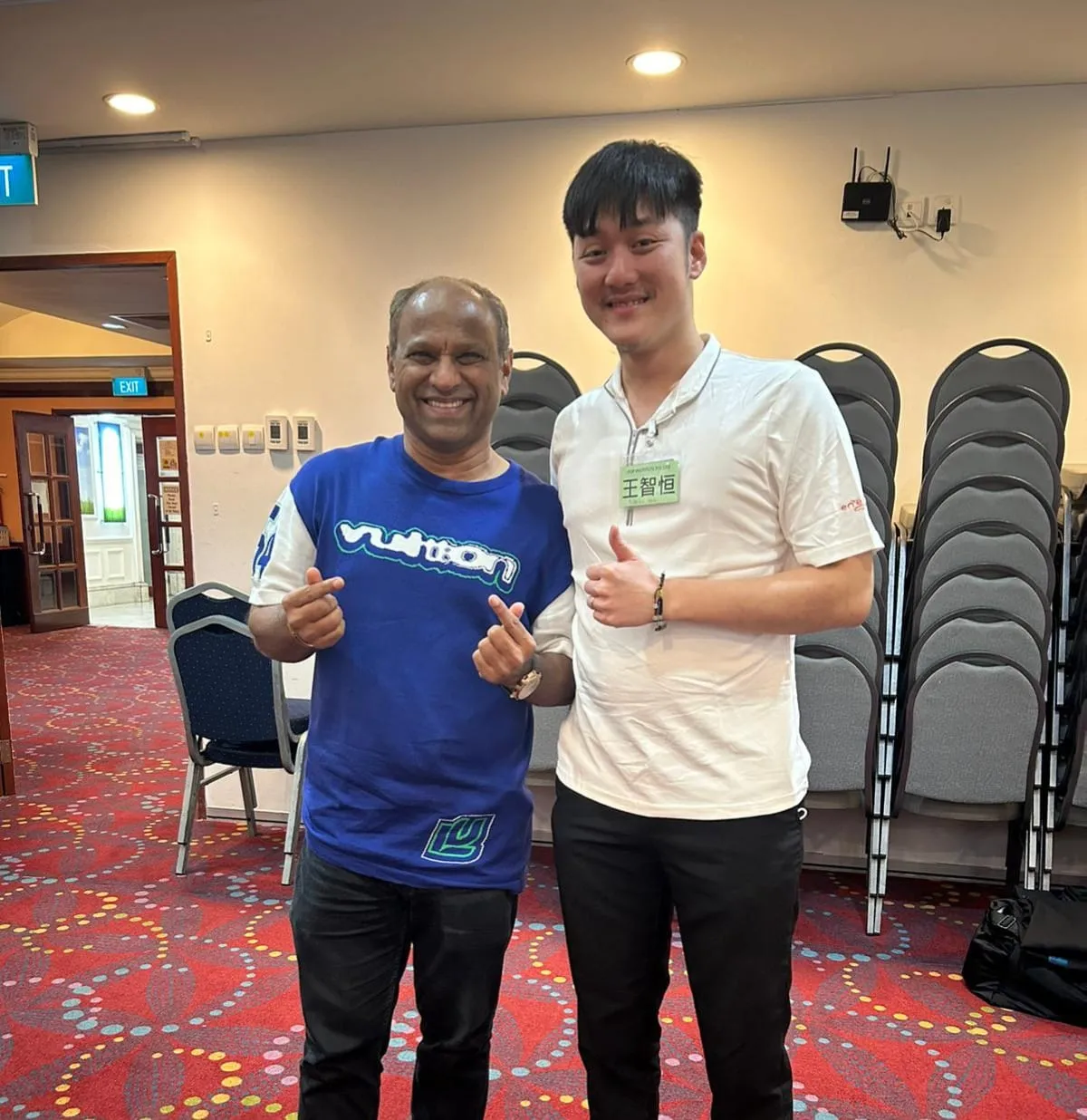 Alaric Ong with Ismail Gafoor, CEO of Propnex