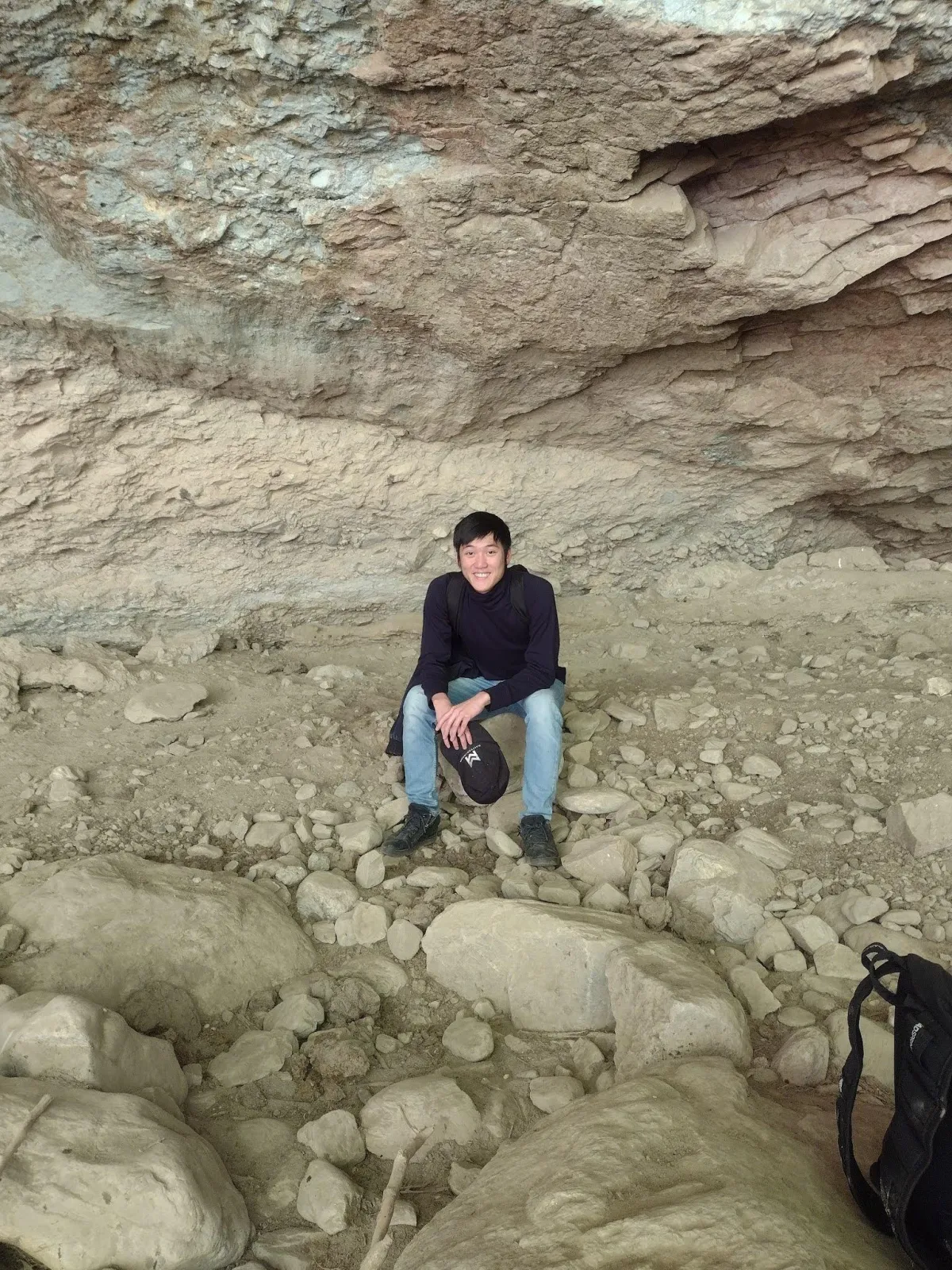 Alaric Ong meditating in a cave in Ecuador