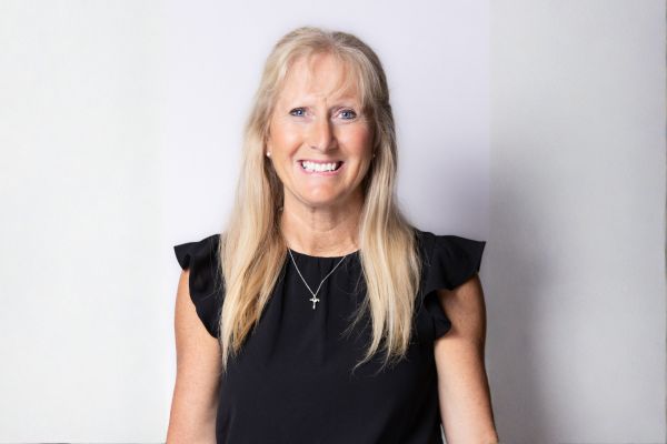 Portrait of Nancy Schuttenbeld against light background