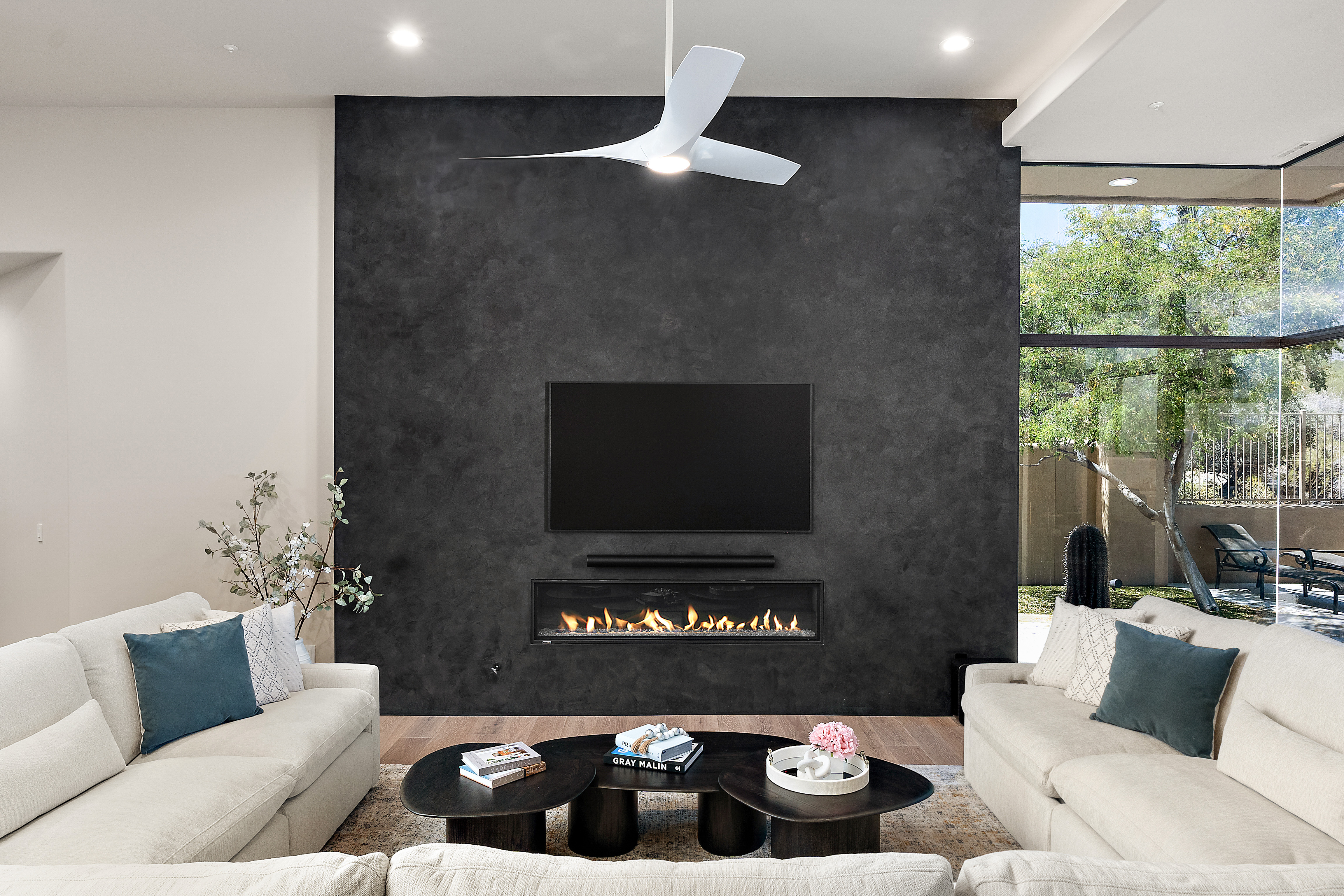 Full-home renovation with modern living room, dark feature wall, and linear fireplace — N&M Home Services, Scottsdale and Paradise Valley AZ