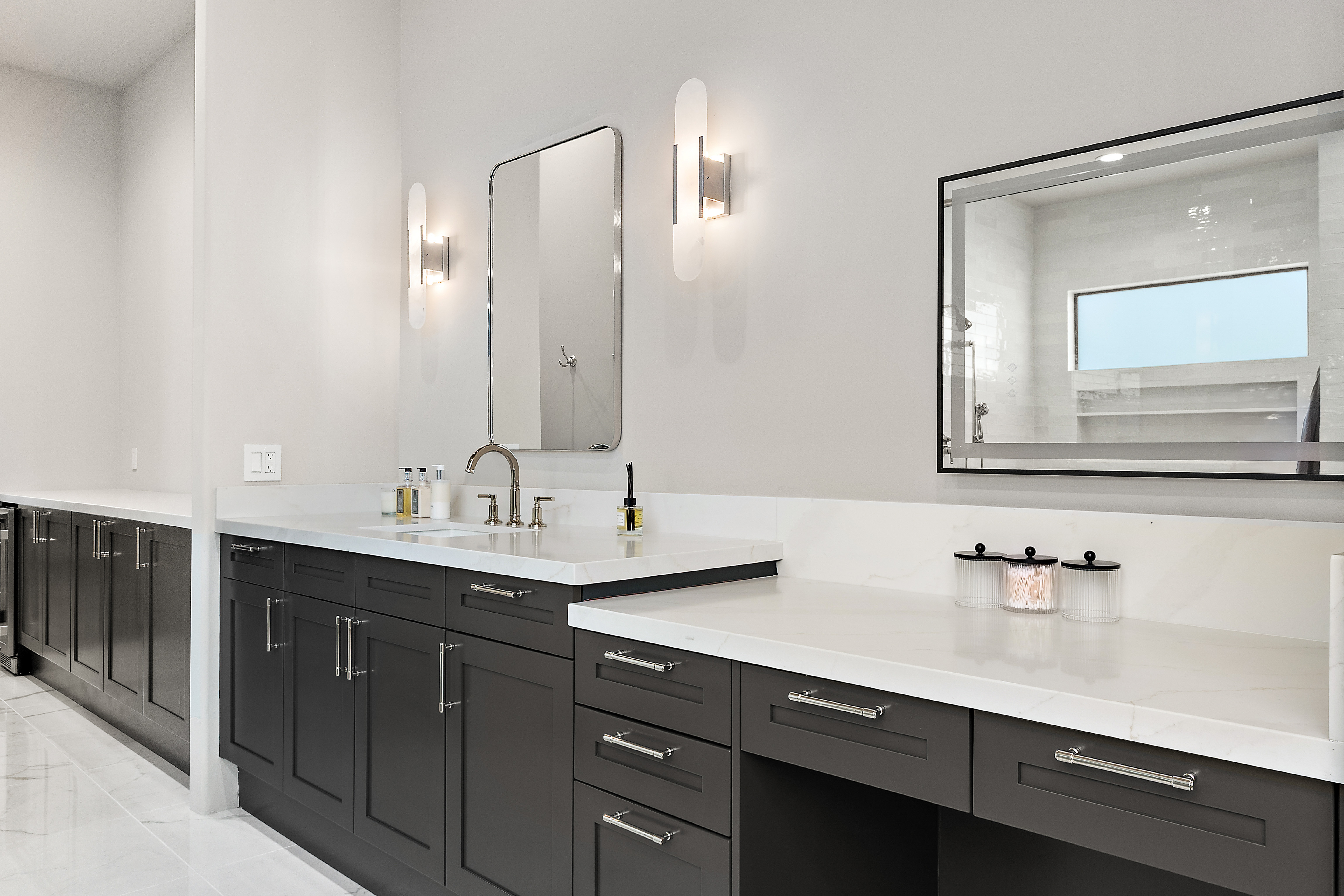 Alt: Luxury master bathroom with extended dark custom cabinetry, white quartz countertops, built-in makeup vanity, and designer wall sconces — N&M Home Services, Scottsdale AZ