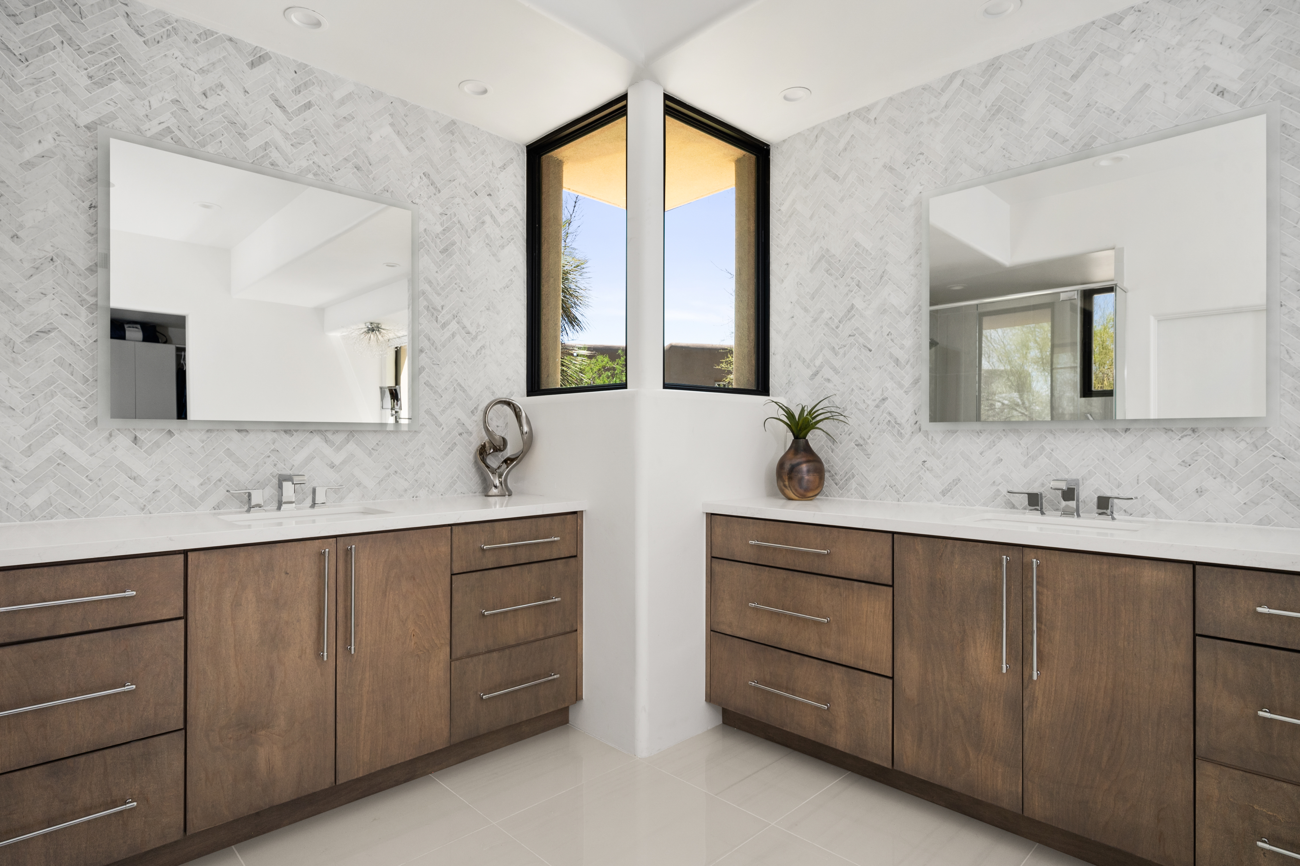 Custom spa shower renovation with dual rainfall shower heads, built-in tile niches, and mosaic stone floor — N&M Home Services, Troon AZ