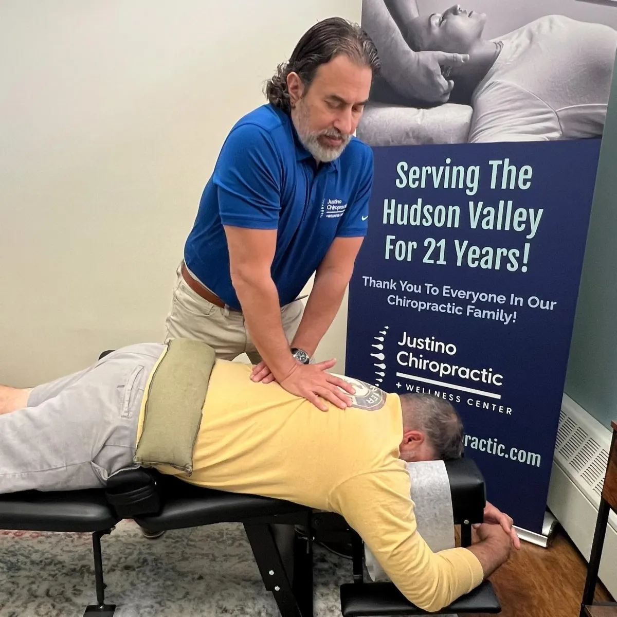 Dr. Vincent Justino performing a chiropractic adjustment to help improve spinal mobility and reduce discomfort