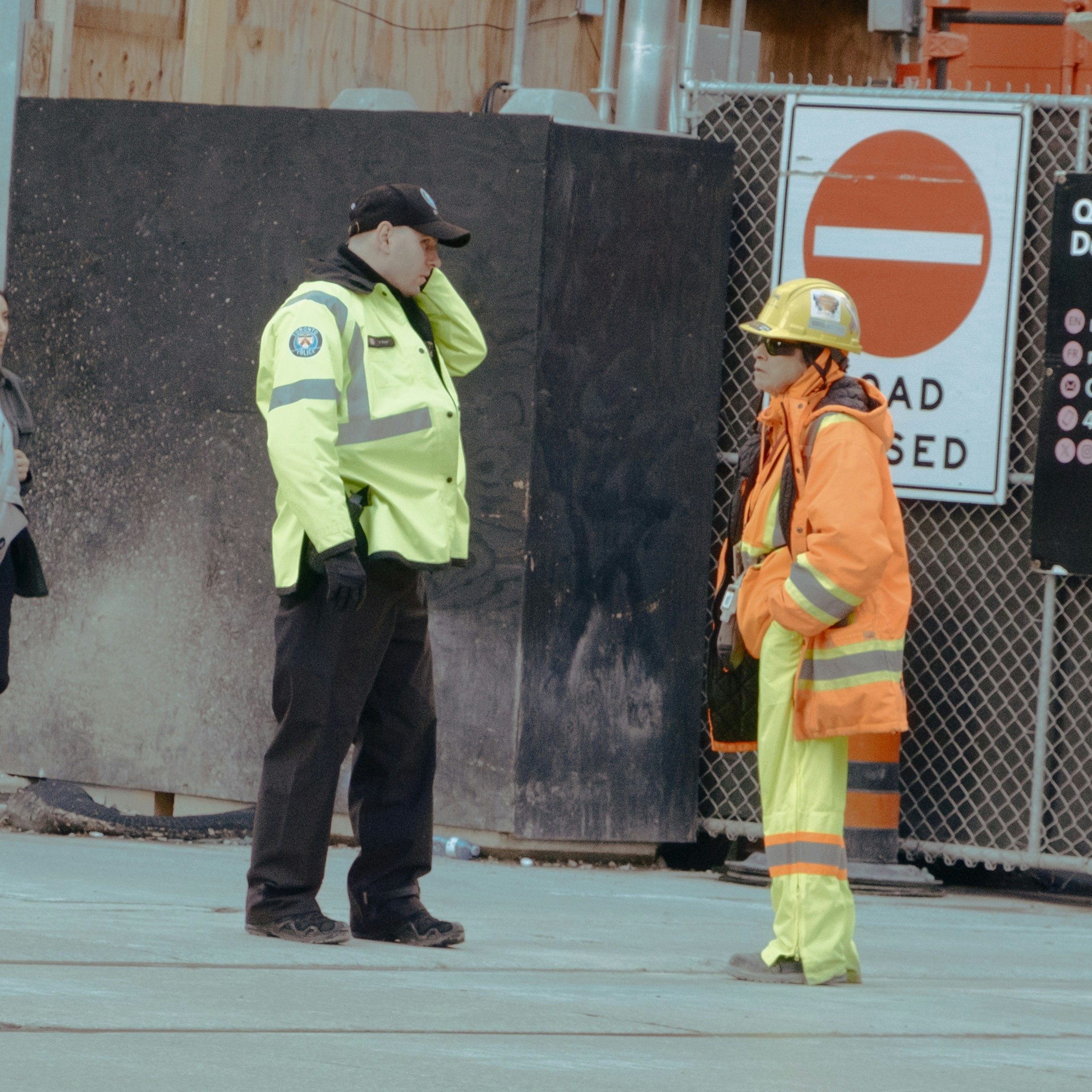 a man wearing a pair of black and blue work gloves