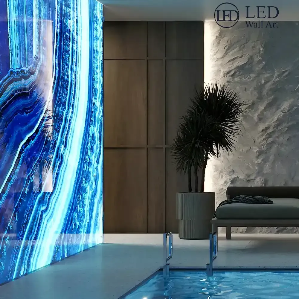 Luxury feature wall with LED backlit Glacial Lumina stone, showing crystalline blue and white patterns." alt="Backlit Glacial Lumina stone panel for an aquatic or luxury interior setting