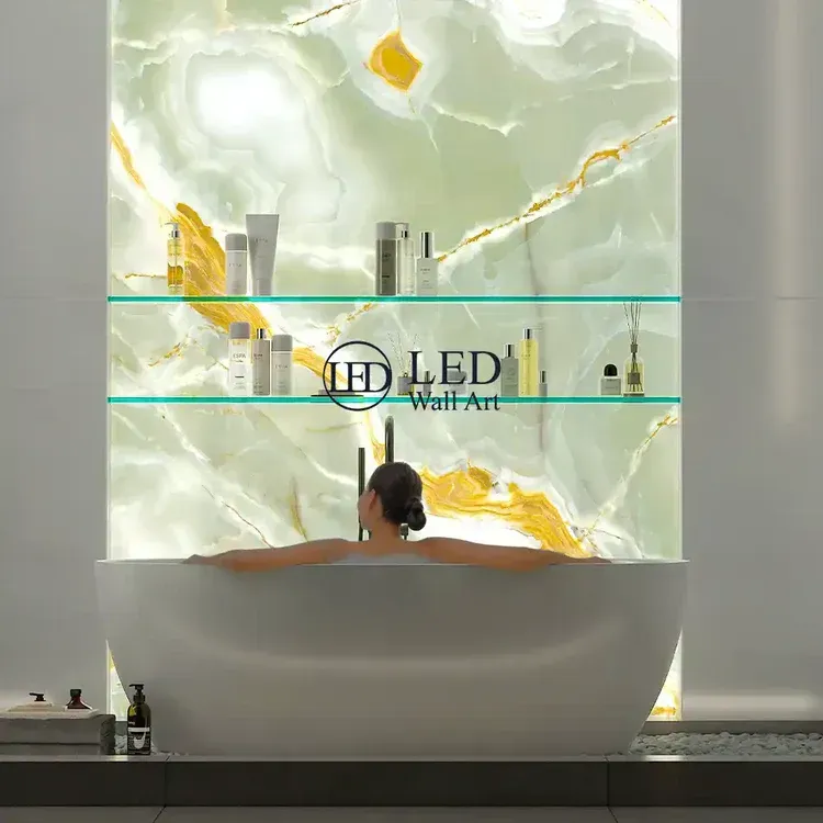 Luxury bathroom with LED backlit green onyx feature wall and illuminated glass shelving over a white bathtub