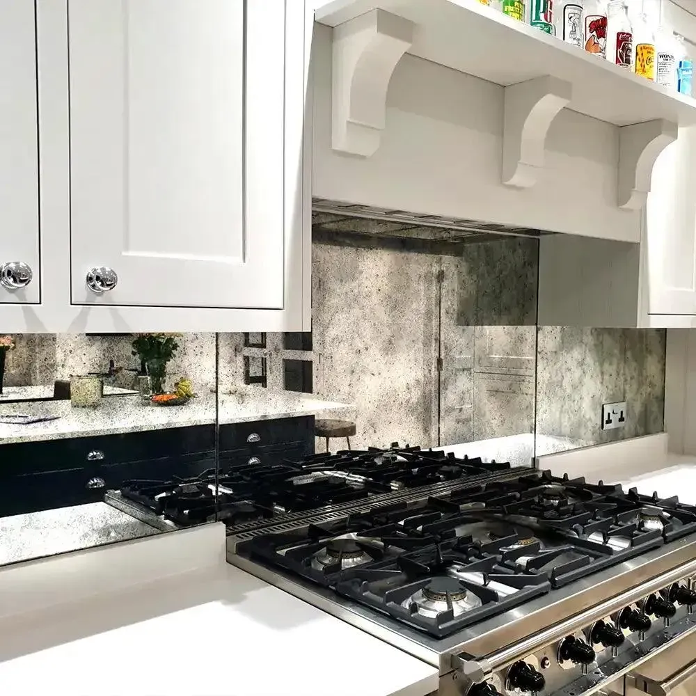 A custom 6mm antique toughened mirror glass splashback in a kitchen | Creoglass