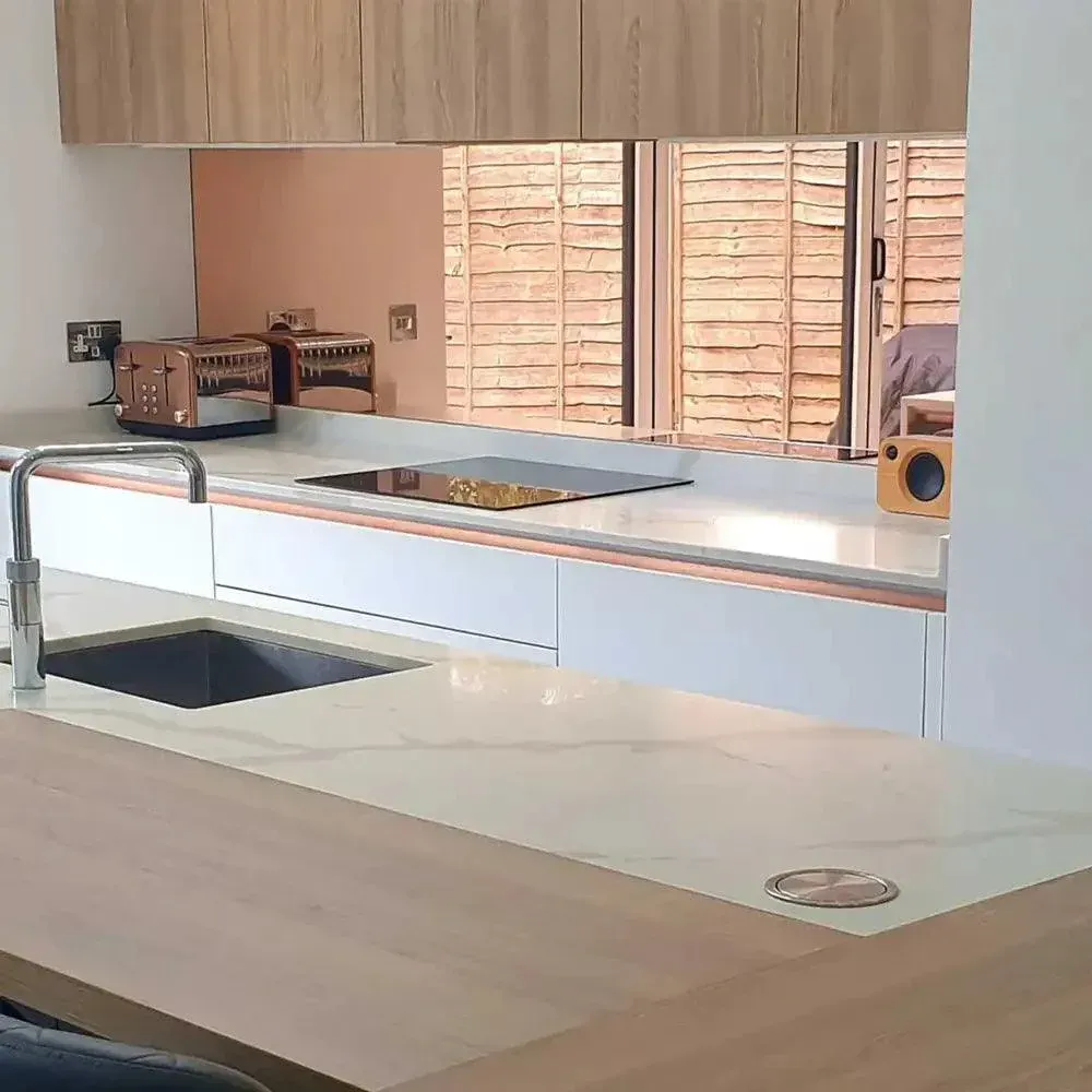 A custom 6mm non toughened mirror glass splashback in a kitchen | Creoglass