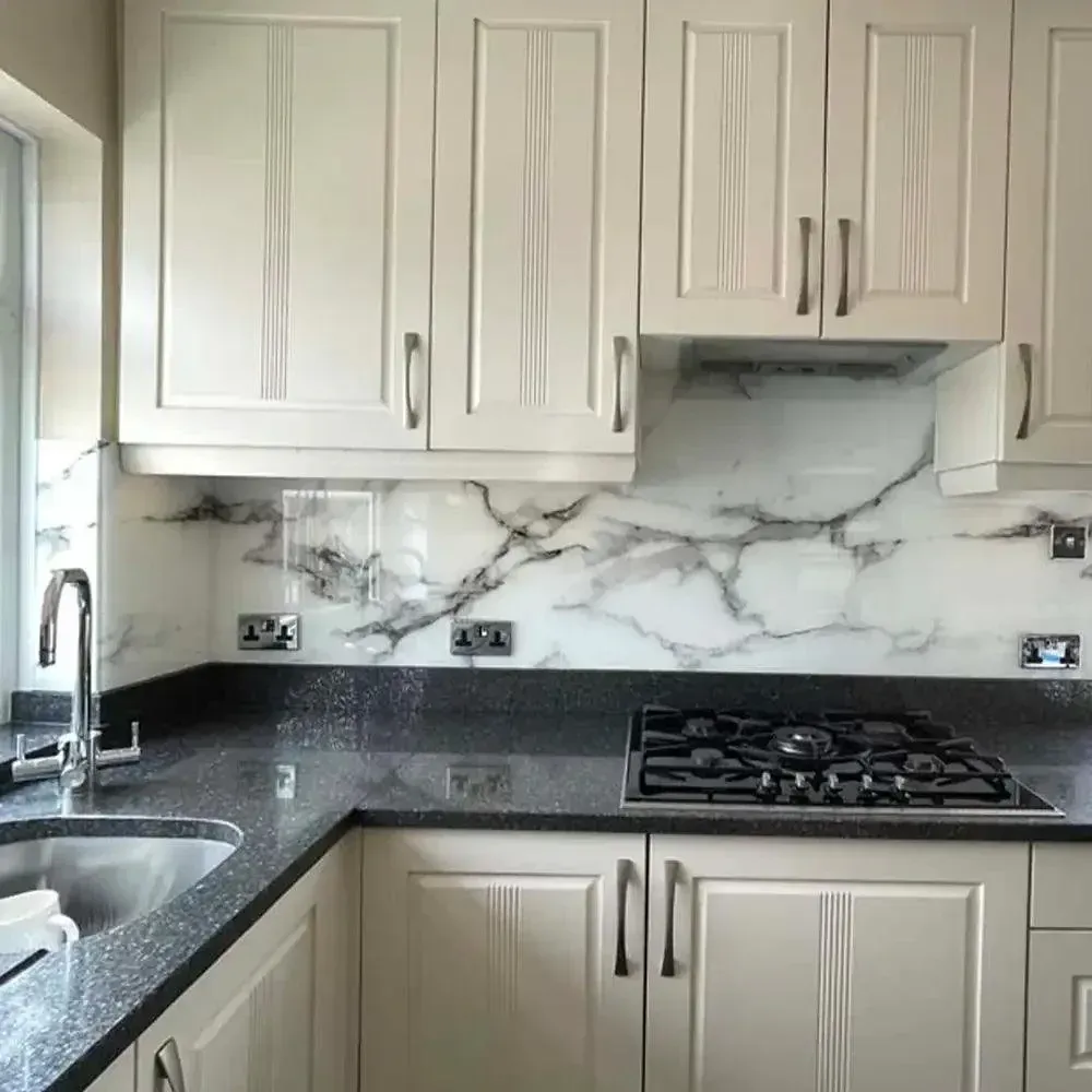 A custom 6mm stones printed glass splashback in a kitchen | Creoglass