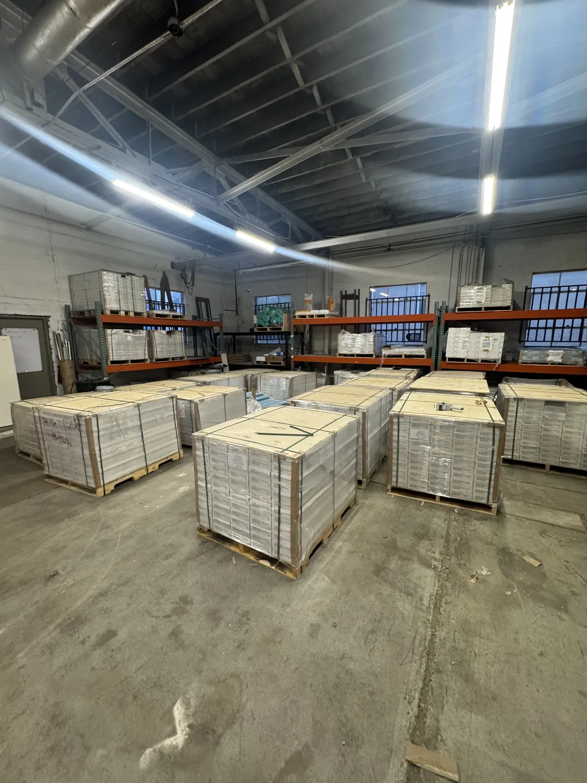 High-contrast commercial flooring warehouse distribution floor with stacked pallets