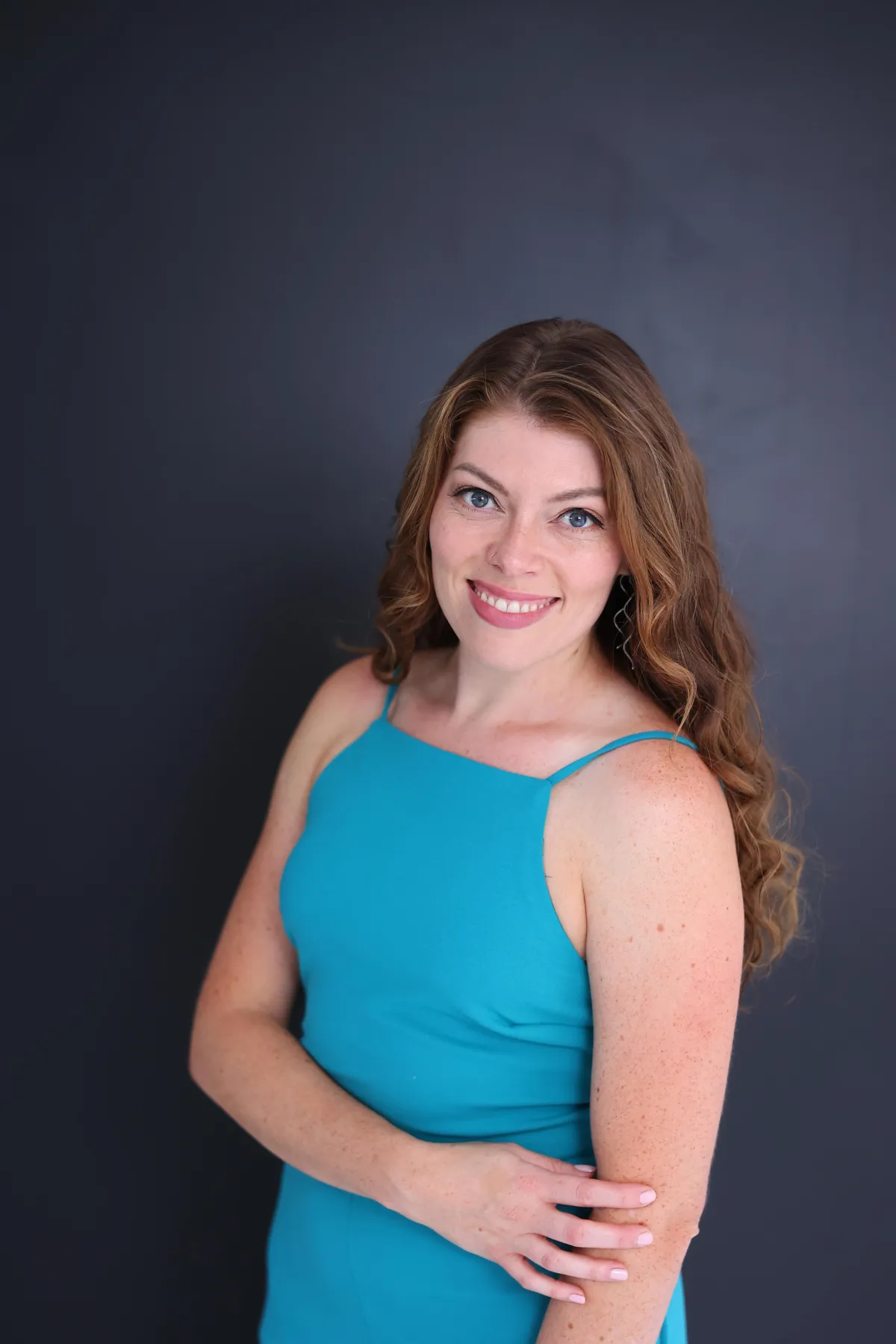 Owner of SHEsynergy smiling for a professional photo