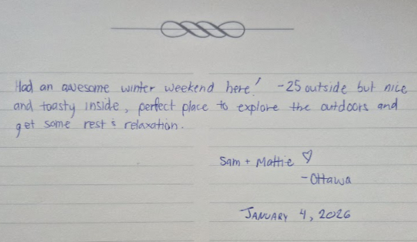 Guest relaxing with a glass of wine on the deck of Cliffside Camp Shelter in Quebec’s Outaouais region, overlooking forest views.