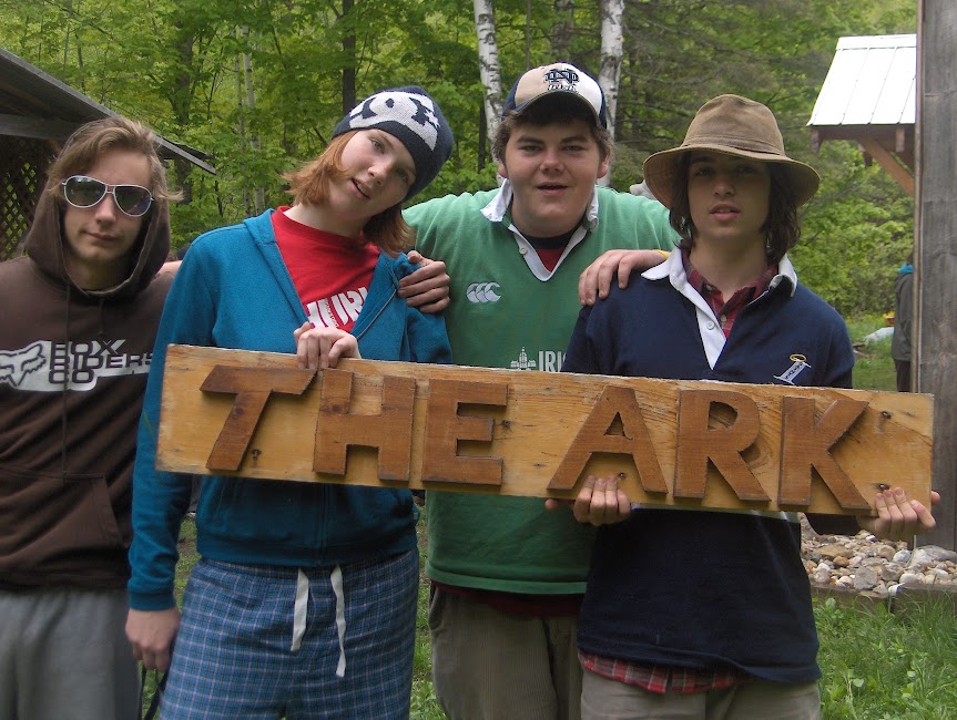 Outdoor education guide teaching a student map and compass navigation skills at The Ark in Denholm, Quebec.