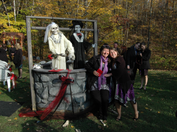 Wedding guests posing together during a playful outdoor celebration