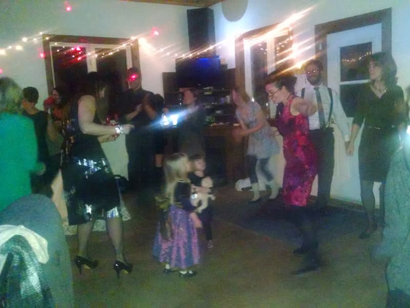 Guests dancing together during a relaxed indoor wedding reception at The Off Grid Ark near Ottawa–Gatineau.