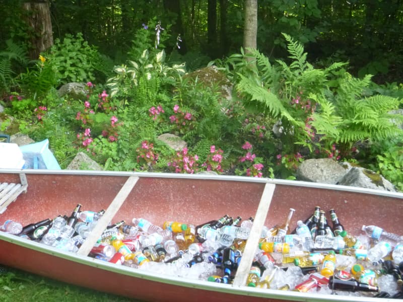 Canoe filled with drinks for a self-serve wedding bar at The Off Grid Ark outdoor wedding venue near Ottawa–Gatineau.