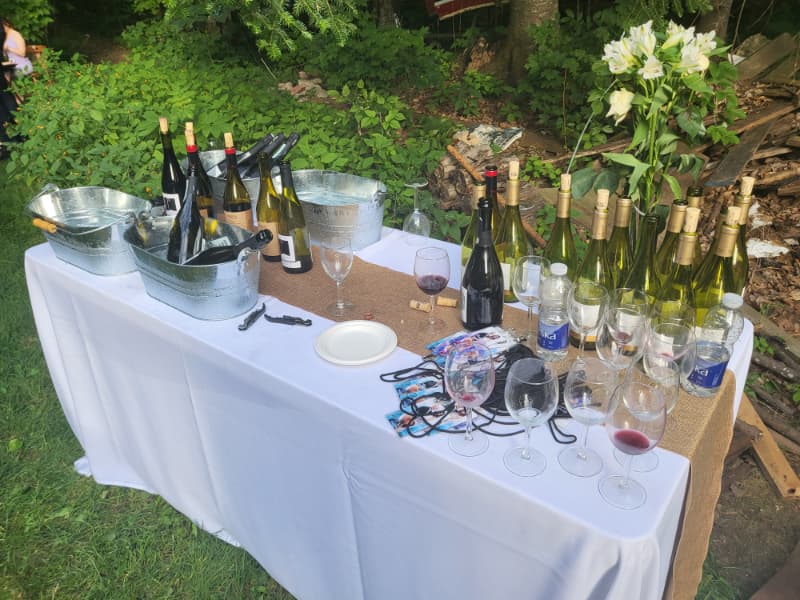 “Self-serve wedding bar with wine and glassware at The Off Grid Ark outdoor wedding venue near Ottawa–Gatineau.