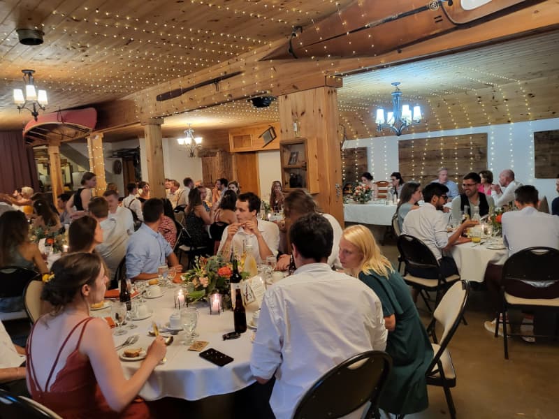 Guests seated for dinner during an indoor wedding reception at The Off Grid Ark near Ottawa–Gatineau.