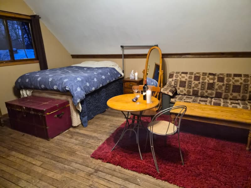 Wedding guests toasting together at a self-serve indoor bar during a reception at The Off Grid Ark near Ottawa–Gatineau.