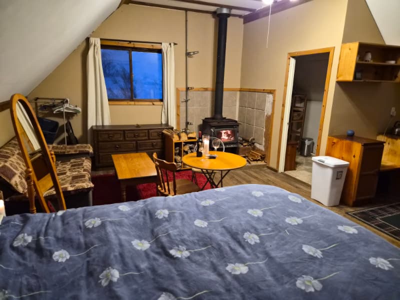Indoor self-serve wedding bar with spirits, beer, and glassware at The Off Grid Ark near Ottawa–Gatineau.