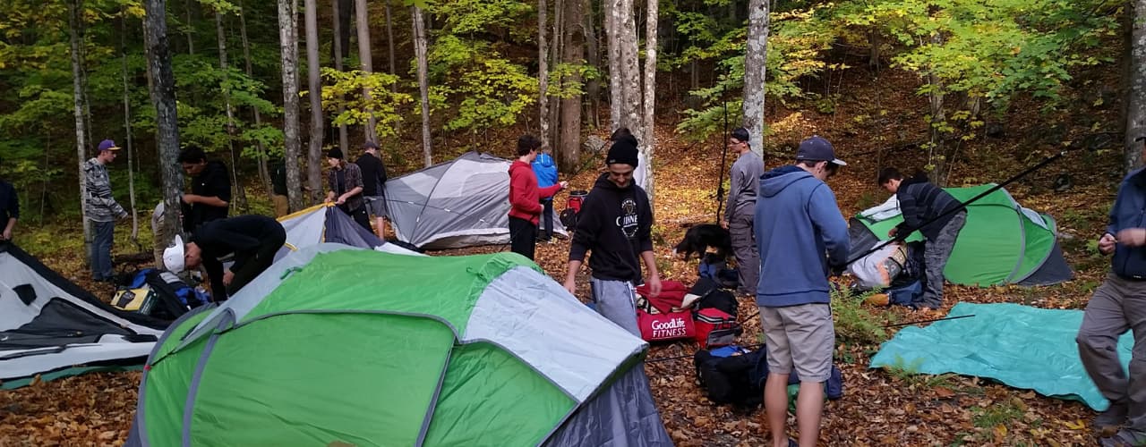family wilderness camp tents set up in forest at The Off Grid Ark in Western Quebec