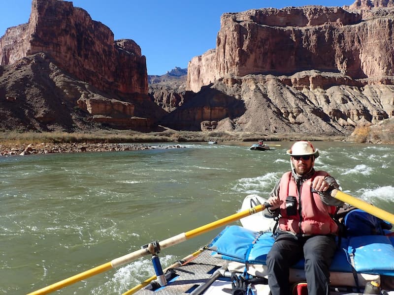 Mike Caldwell guiding a whitewater raft through the Grand Canyon on the Colorado River.