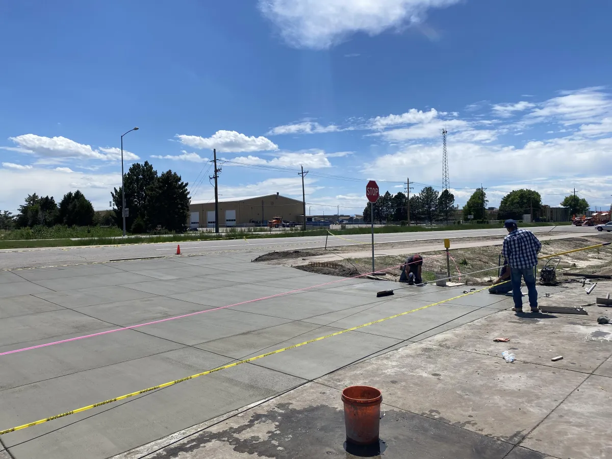 gray concrete staircase with red and white printed wall