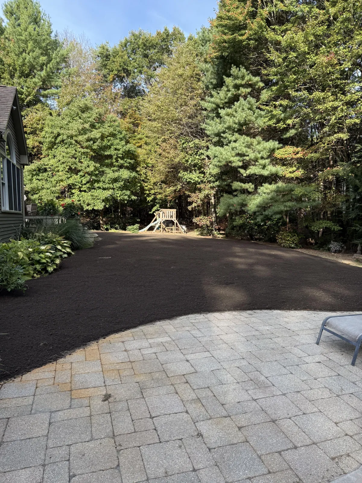 Graded residential backyard prepared for landscaping and outdoor living space by A. Fowkes Landscape & Construction