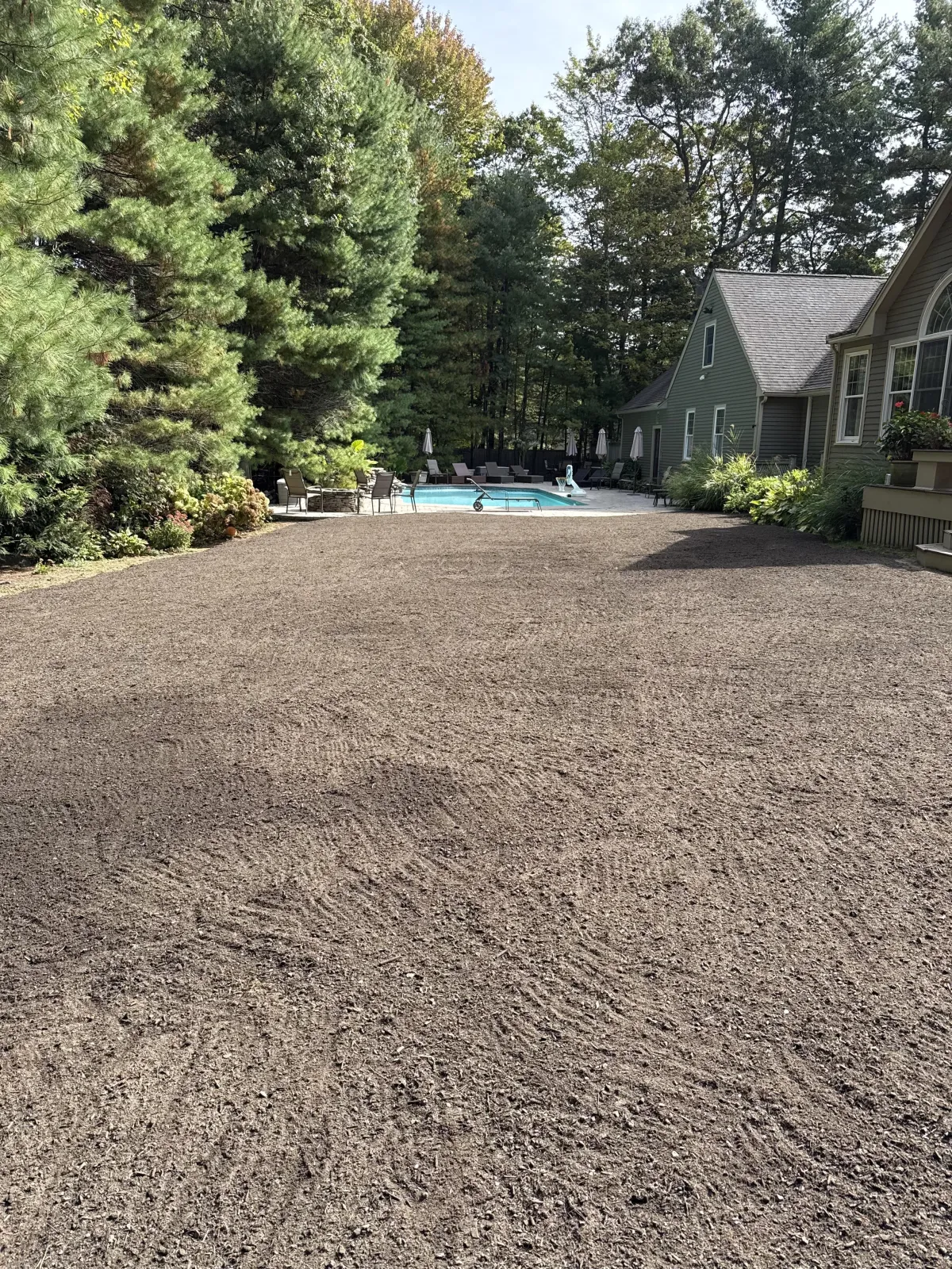 Residential backyard grading and site preparation for lawn or hardscape installation by A. Fowkes Landscape & Construction