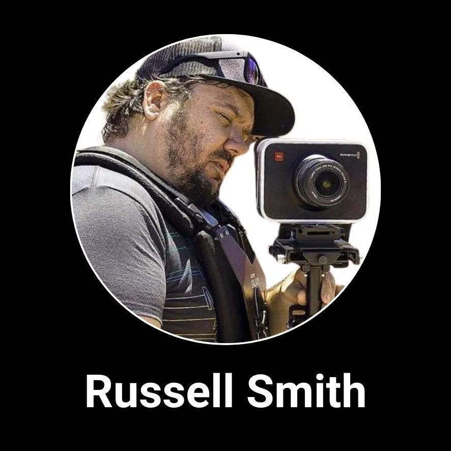 Professional headshot of Newmanity Global Associate Team member, Russell Smit, in business attire, representing the company’s leadership and global collaboration