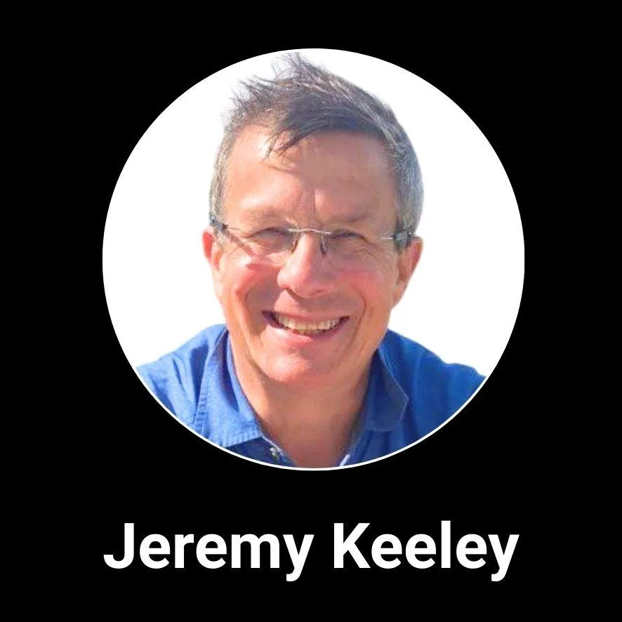 Professional headshot of Newmanity Global Associate Team member, Jeremy Keeley, in business attire, representing the company’s leadership and global collaboration