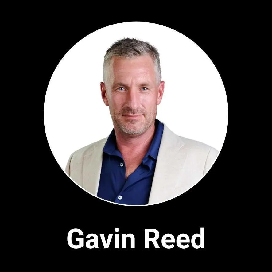 Professional headshot of Newmanity Global Associate Team member, Gavin Reed, in business attire, representing the company’s leadership and global collaboration