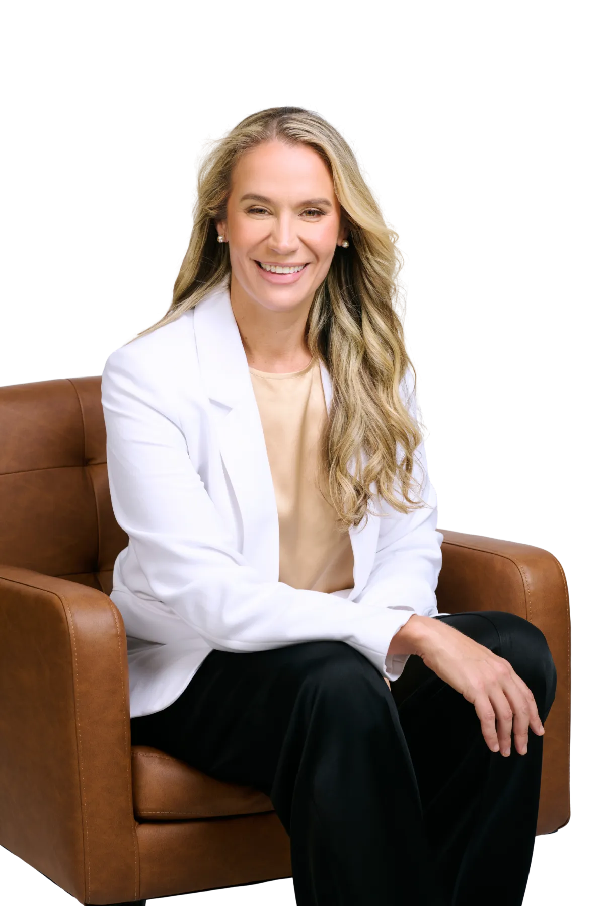 Ana Reed sitting in an elegant chair, smiling warmly