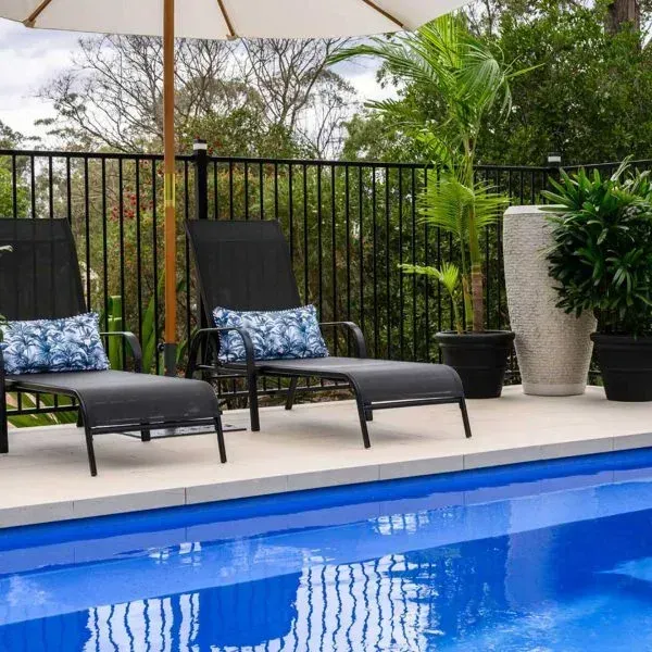 Crystal-clear blue pool water by Poseidon Pools CQ