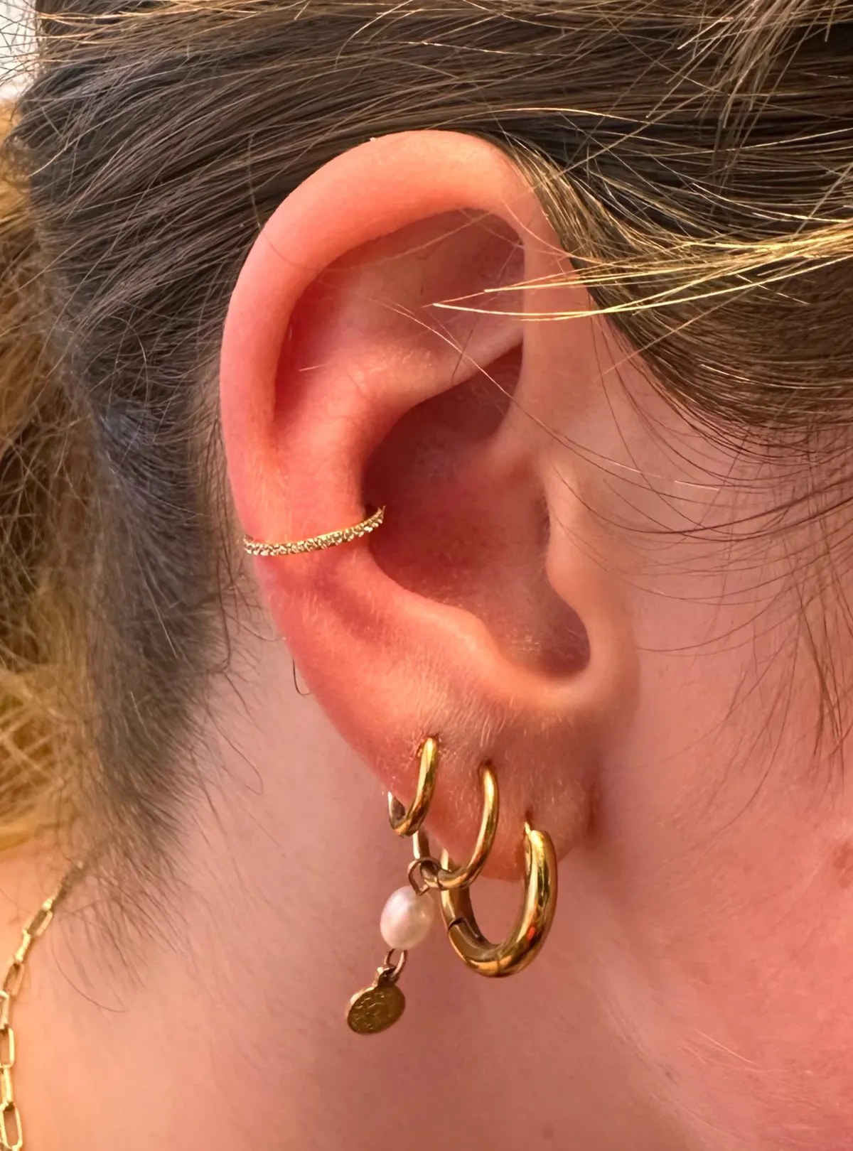 conch piercing Deventer Iris Tattoo Art