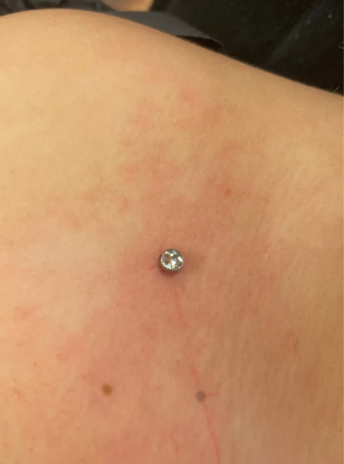 dermal piercing Deventer Iris Tattoo Art