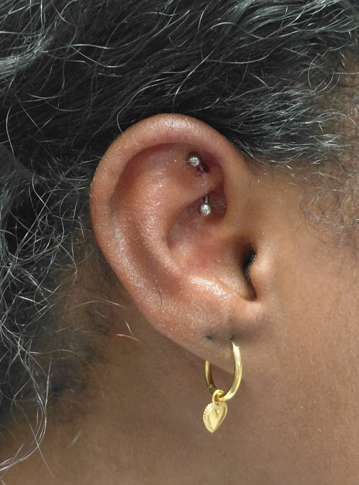 rook piercing Deventer Iris Tattoo Art