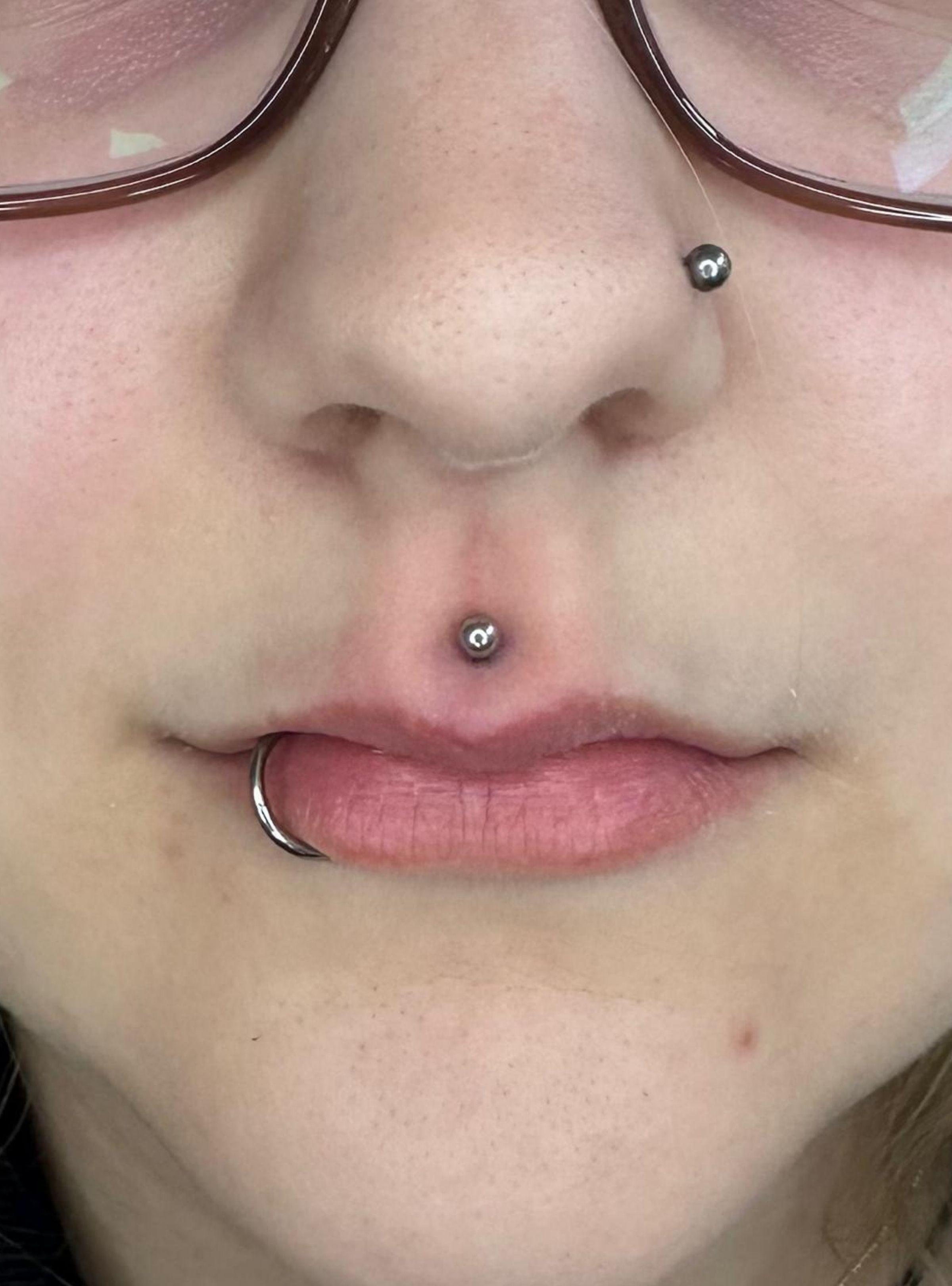 tragus, rook piercing Deventer Iris Tattoo Art