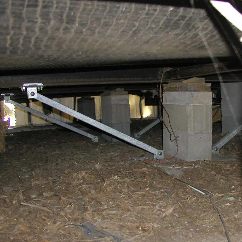 A set of newly installed, rust-resistant mobile home tie-downs securing a home in Leesburg for hurricane season.