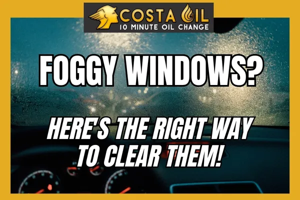 Foggy car windshield showing condensation and defrost controls