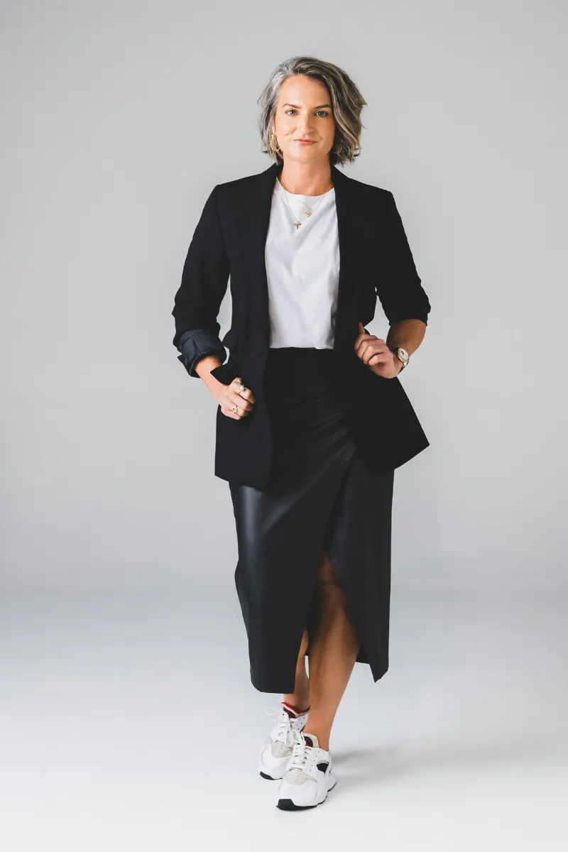 Professional portrait of Amy Green speaking at a conference
