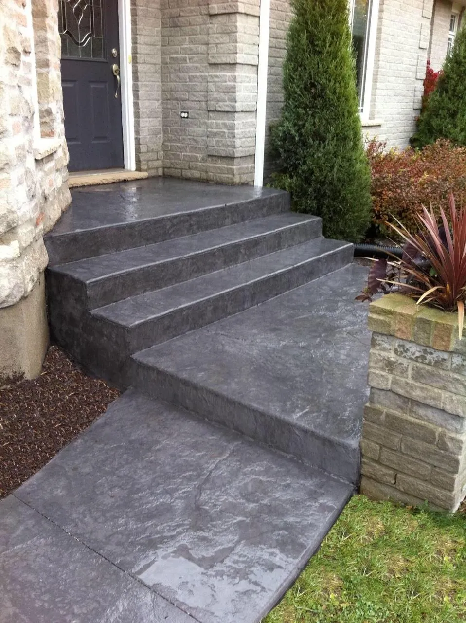 Stamped concrete steps with natural stone pattern installed by Lex Concrete Solutions