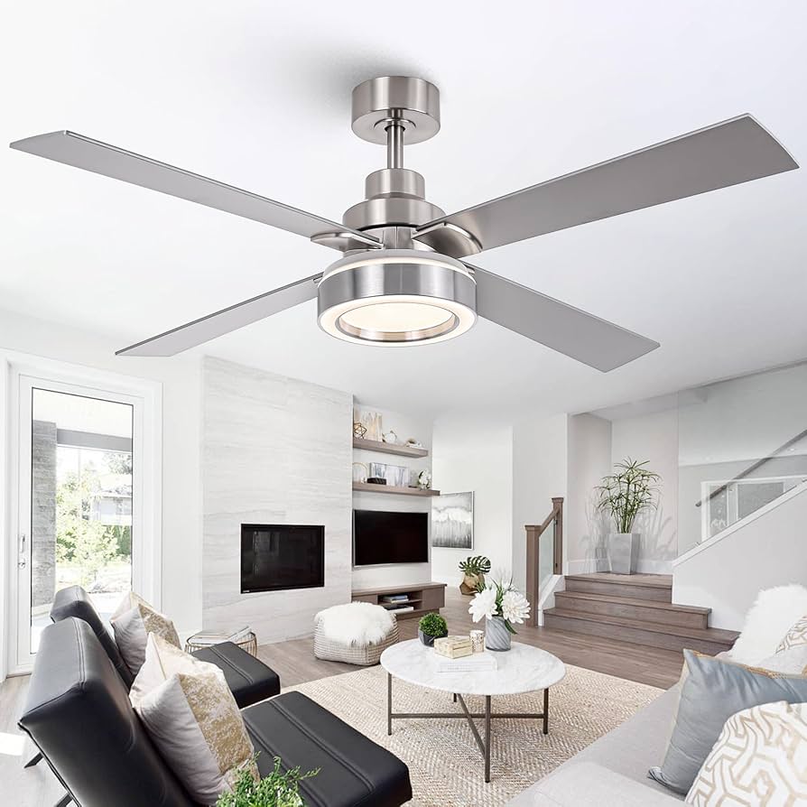 Modern living room with brushed nickel ceiling fan featuring integrated LED light and contemporary interior design.
