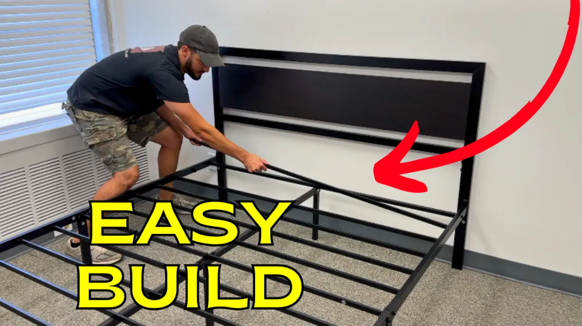 Man assembling metal bed frame with headboard duriDIY furniture assembly project.